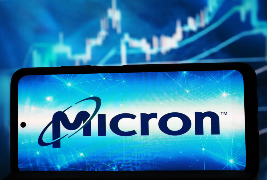 Microsoft logo displayed on a blue digital background with network lines and glow effects