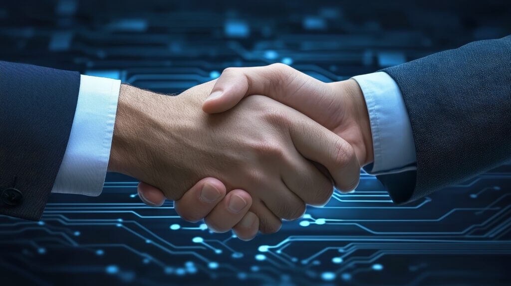 Synergy and innovation, two men seal a technology partnership with handshake over circuit board - Semicon.TODAY