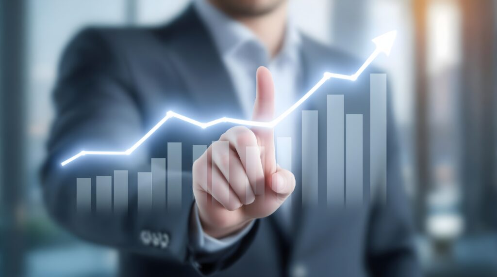 Professional Businessman in Suit Pointing Finger at Digital Glowing Upward Trend Line Graph and Bar Chart on Touch Screen for Business Growth, Financial Success, Investment Strategy, and Technology - Semicon.TODAY