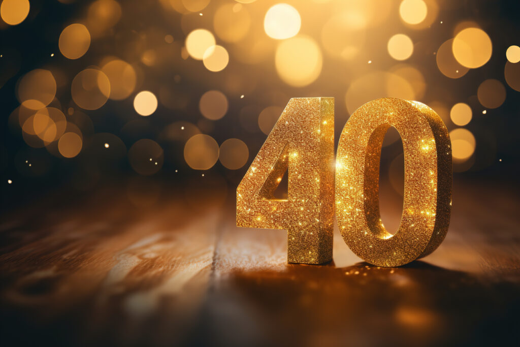 Golden sparkling number forty on dark background with bokeh lights Symbol 40 Invitation for a fortieth birthday party or business anniversary - Semicon.TODAY