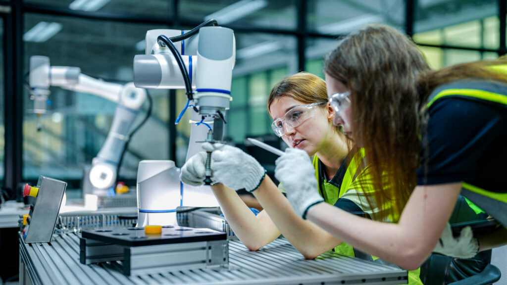 robotics engineer in an RD lab performs diagnostics on an AI-driven collaborative robot cobot She is inspecting the hardware and system sensors - Semicon.TODAY