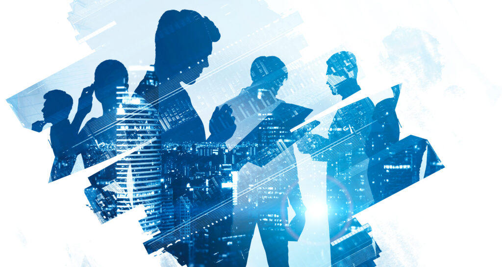 Diverse business team in city partnership - SEMICON.TODAY Silhouetted business team in discussion overlaid with a blue cityscape background.