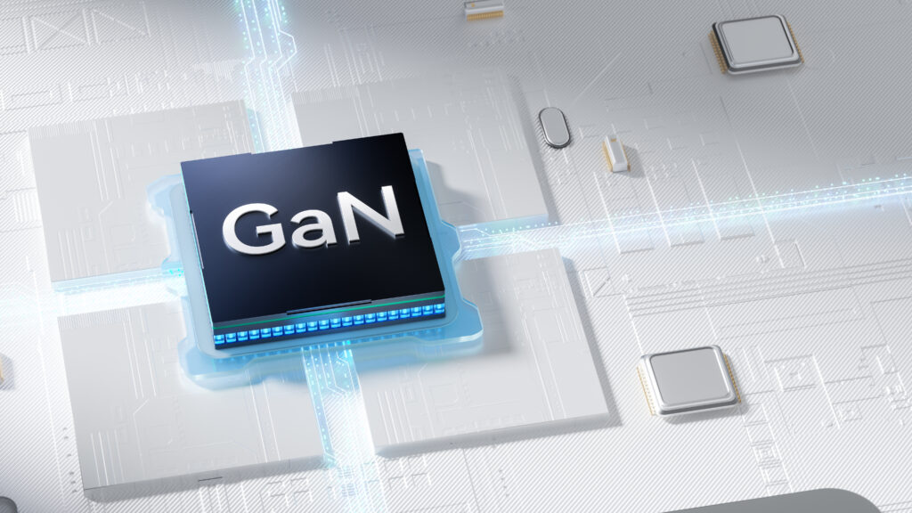 GaN semiconductor chip mounted on a blue circuit board in a high-tech layout.