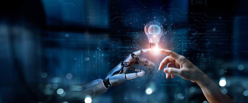 Human and robotic hands touch fingertips as a glowing bulb with a brain between them, symbolizing human-AI collaboration.